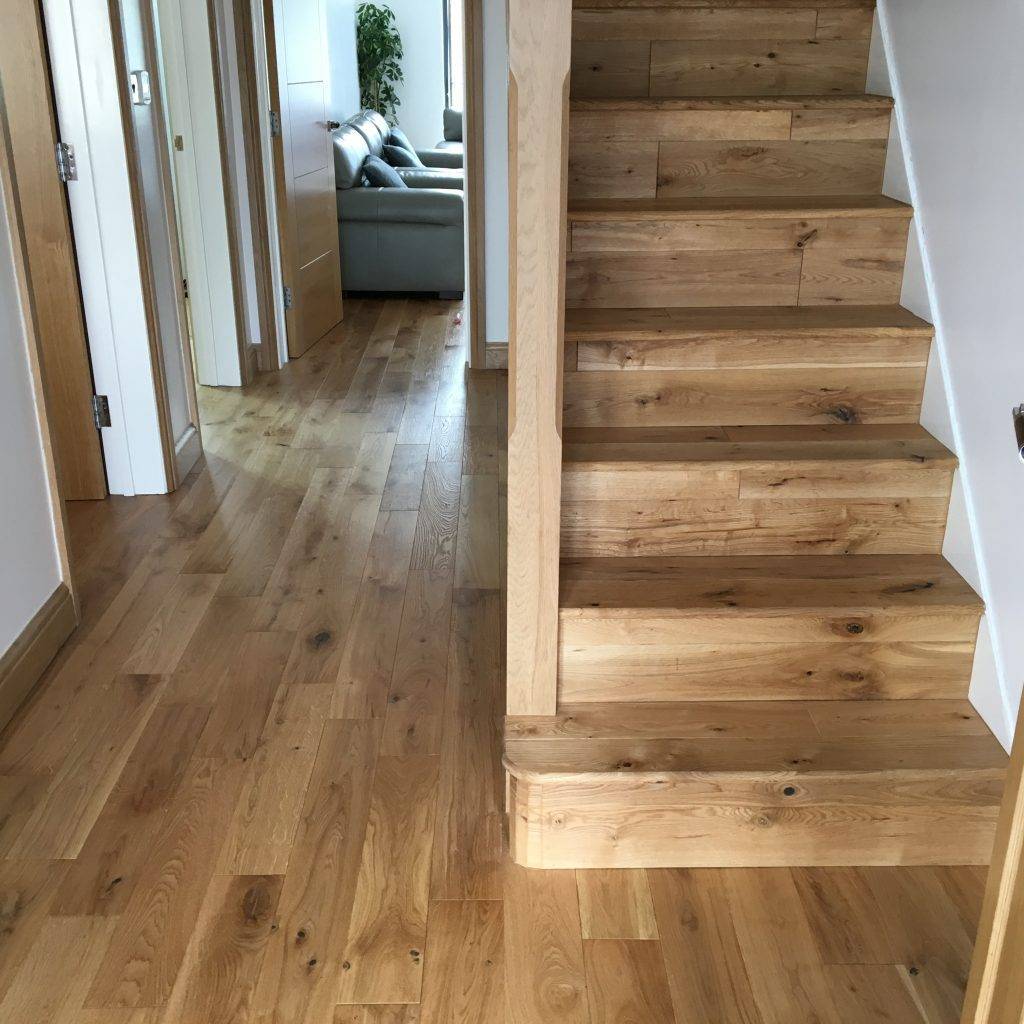 Solid oak flooring fitting job in hall and staircase