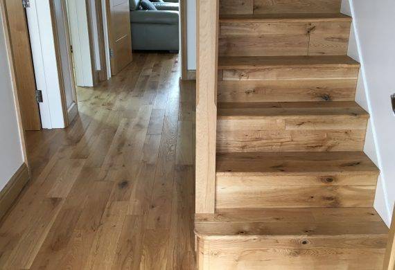 Solid oak flooring fitting job in hall and staircase