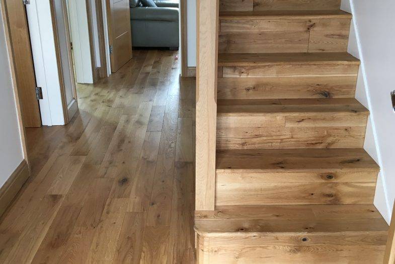 Solid oak flooring fitting job in hall and staircase