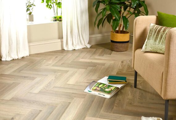Engineered real wood herringbone flooring in a bright Cannock living room with autumn decor