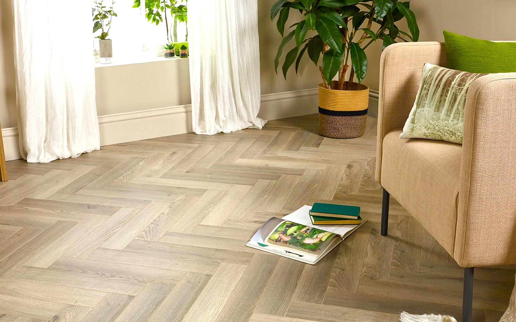 Engineered real wood herringbone flooring in a bright Cannock living room with autumn decor